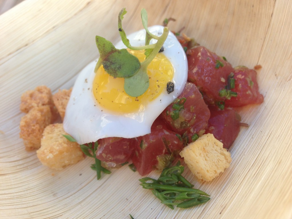 A dish from the Hawaii Food and Wine Festival in Honolulu: poke (lightly seasoned cubes of ahi tuna) topped with a quail egg, micro greens, and croutons. The HFWF is held annually around the islands, this was from an event at the Hawaii Convention Center.