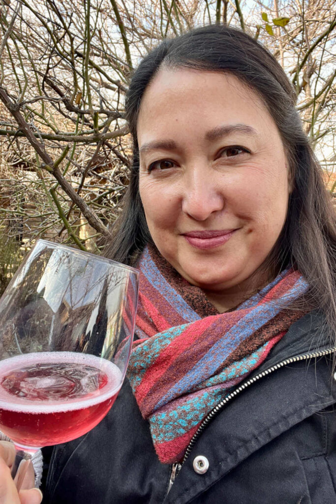 Malia Yoshioka drinking rose wine while in Maui