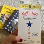 A box of Koda Farms Blue Star Mochiko flour (sweetened rice flour) and two cookbooks from Hawaii - Ethnic Foods of Hawaii and Makawao Maui Cookbook. Mochiko recipes from Hawaii include things like mochiko chicken, mochi, chichi dango, ozoni soup, and butter mochi.