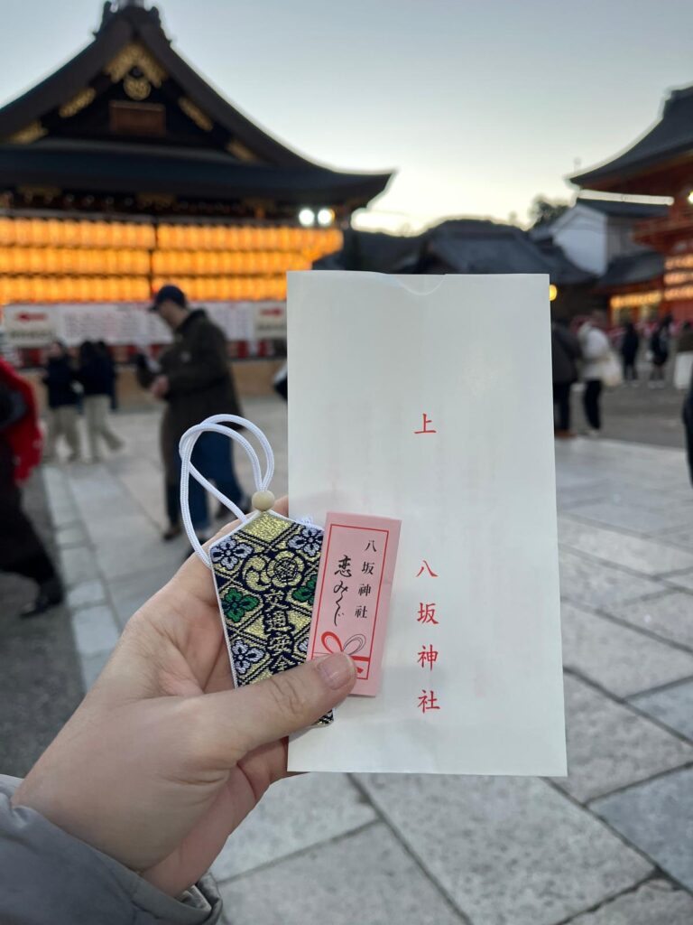 Omamori and omikuji from Yasaka shrine in Kyoto for new years day, January 1, 2026 just before sunrise.